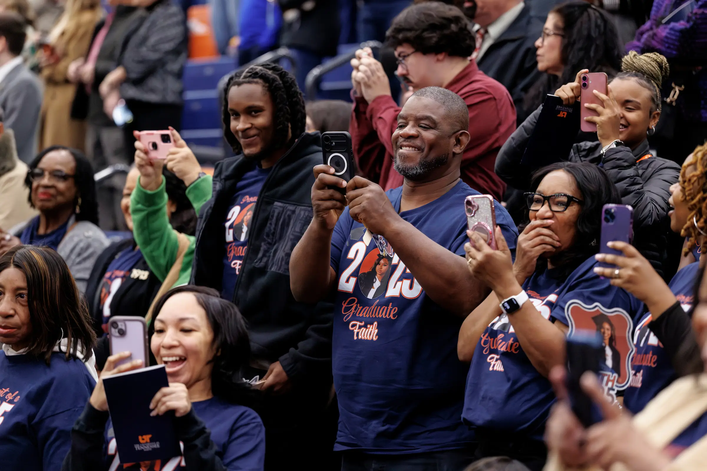 Family members celebrate a Skyhawk graduate.